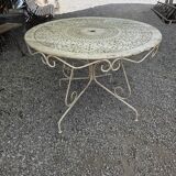 Old garden table in solid wrought iron