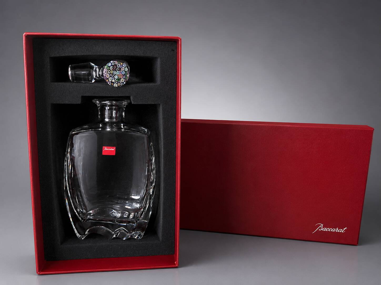 Baccarat crystal carafe with millefiori stopper and original box.