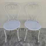 Pair of wrought iron garden chairs, antique manufacture