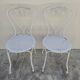 Pair of wrought iron garden chairs, antique manufacture