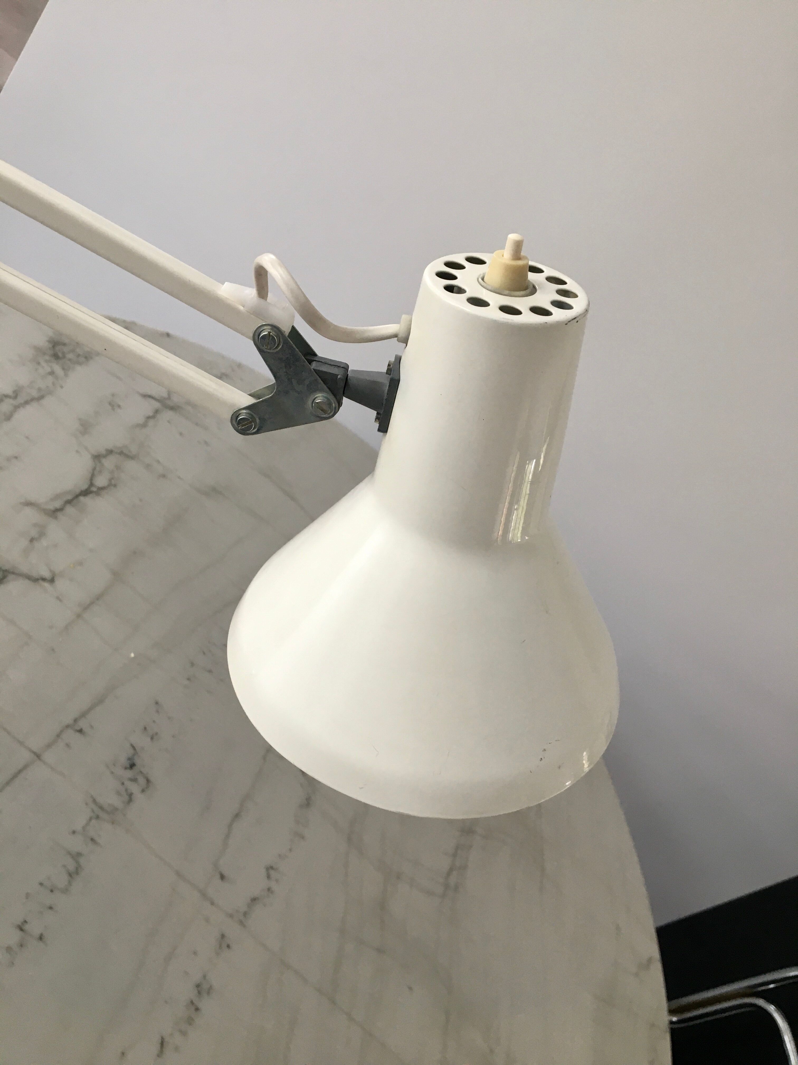 Off-white articulated architect lamp.