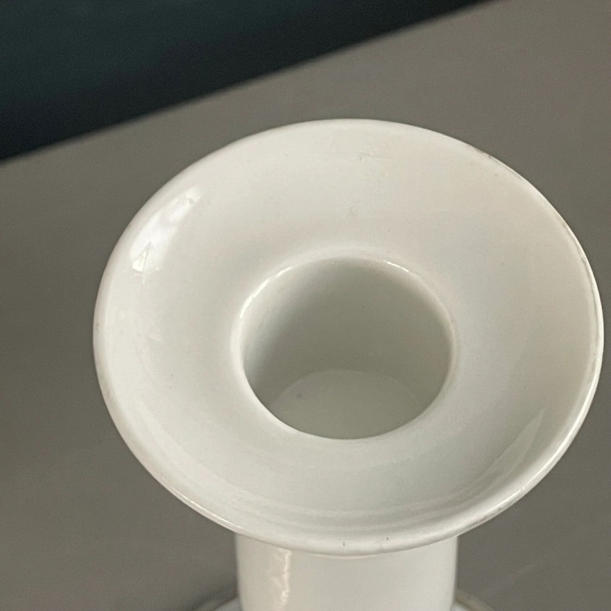 Pair of porcelain candlesticks with a gold pattern.