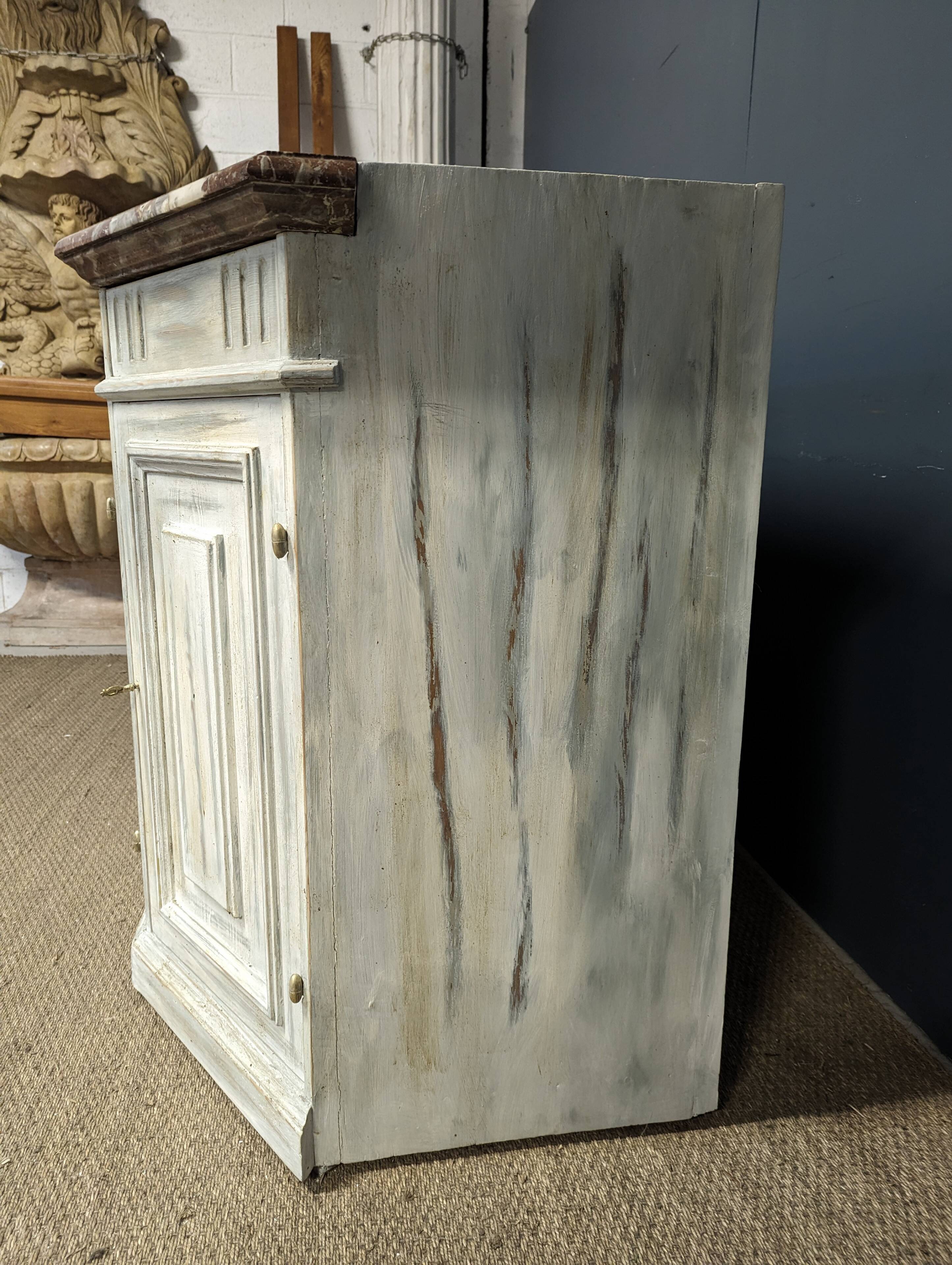 Low patinated sideboard with griotte marble top