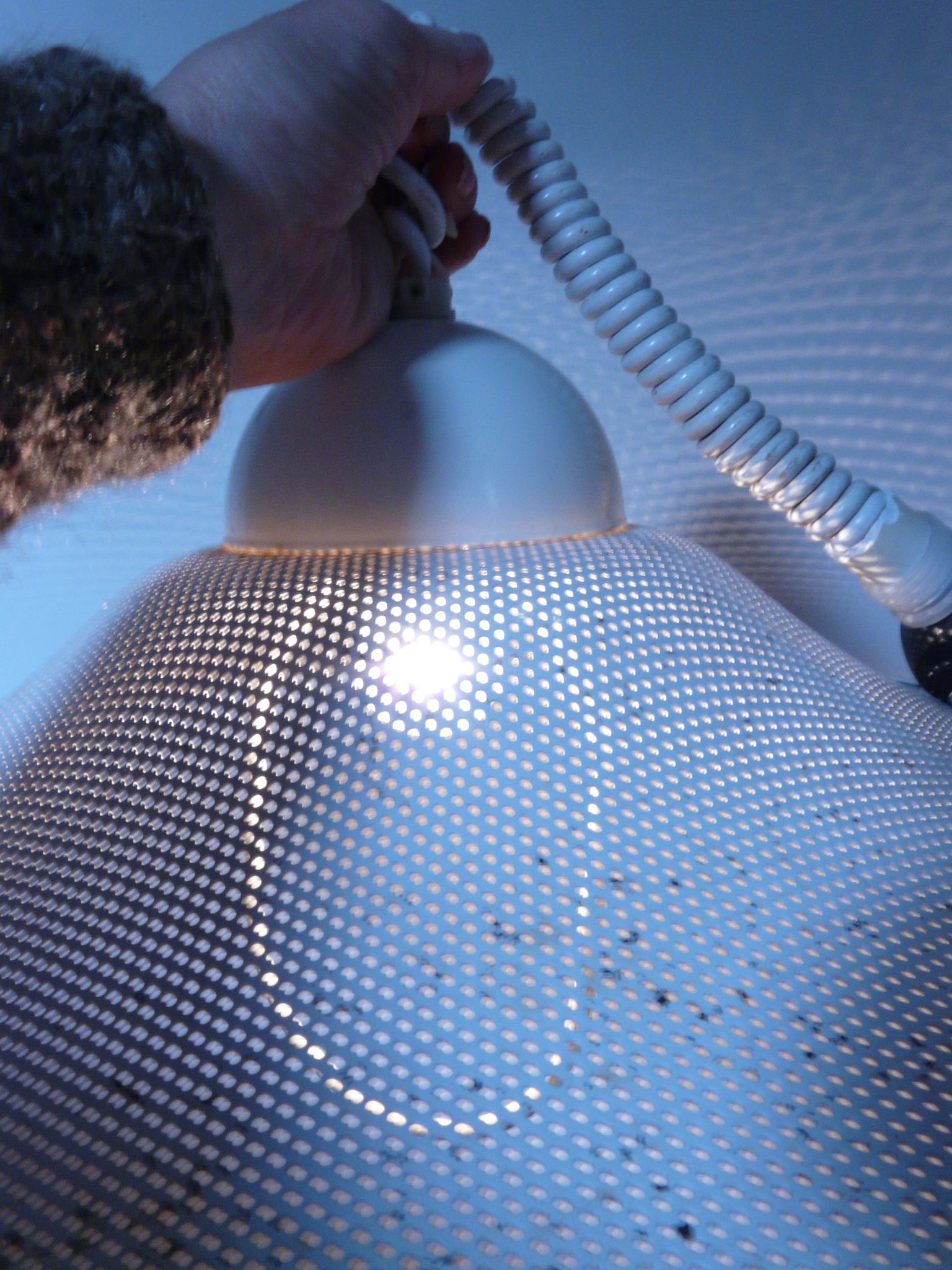 White perforated sheet metal chandelier