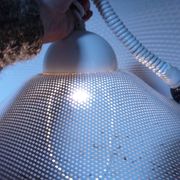 White perforated sheet metal chandelier