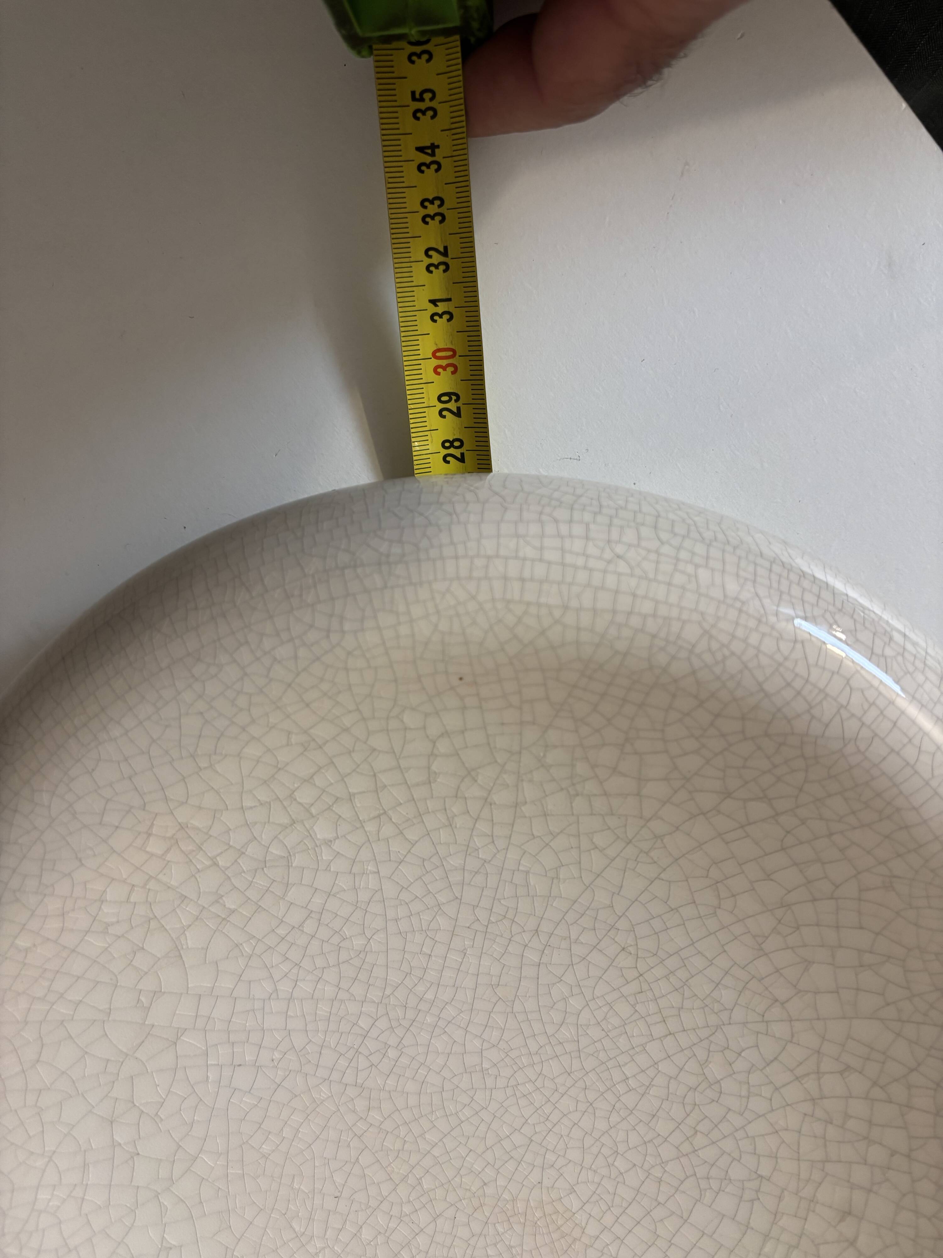 Empty pocket, cracked ceramic dish 1980