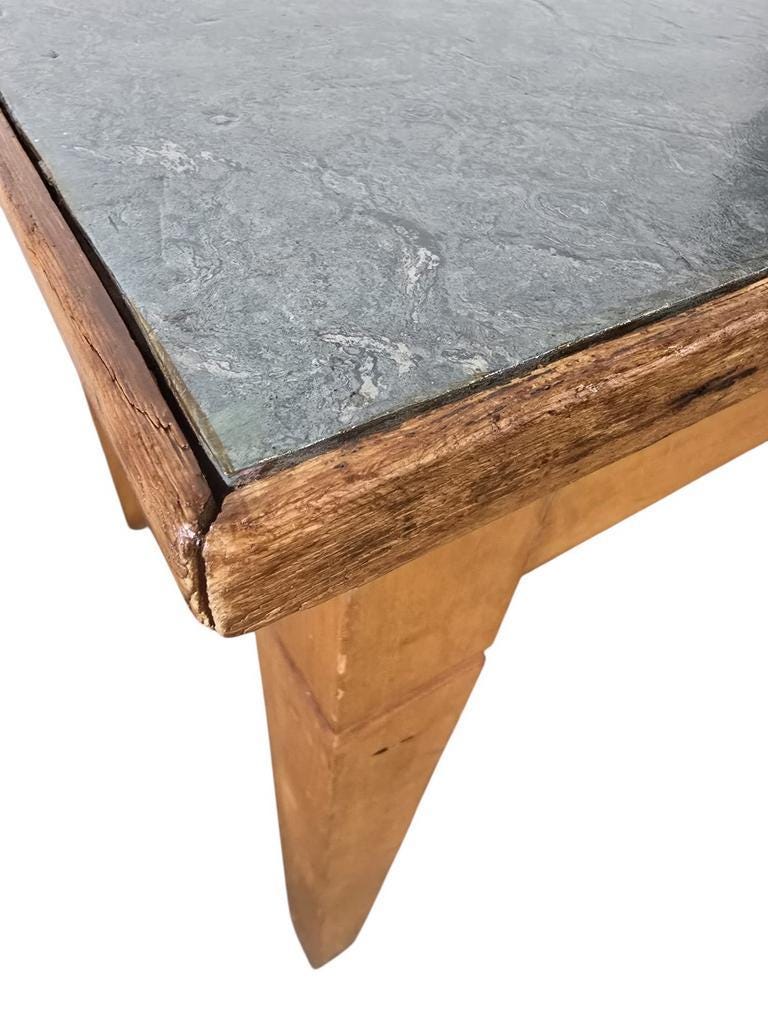 Vintage wooden table with a mint green top.