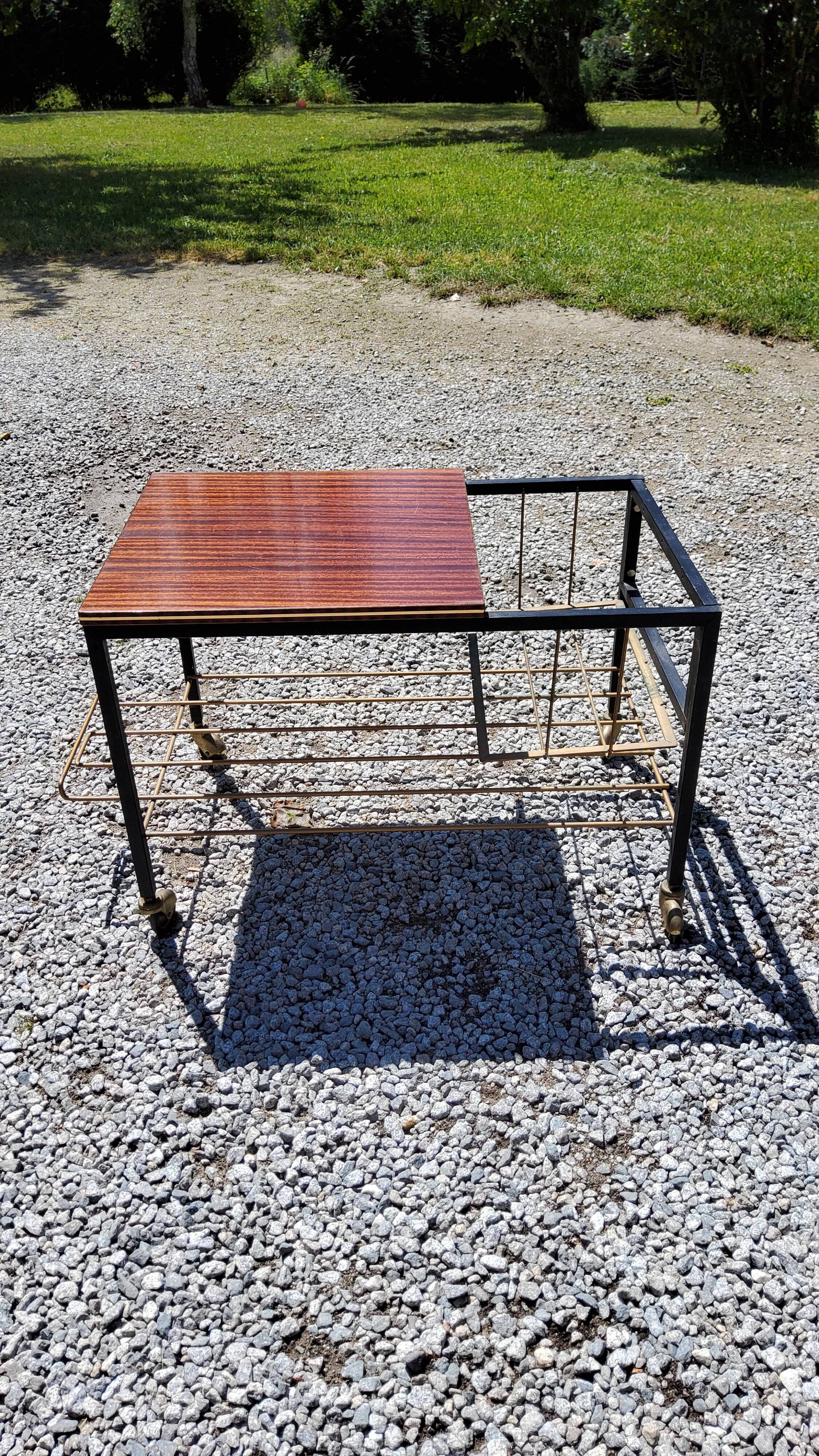 Coffee table from the 60s in black and gold metal tubes mahogany formica top