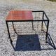 Coffee table from the 60s in black and gold metal tubes mahogany formica top