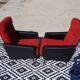 Vintage pair of red and black armchairs