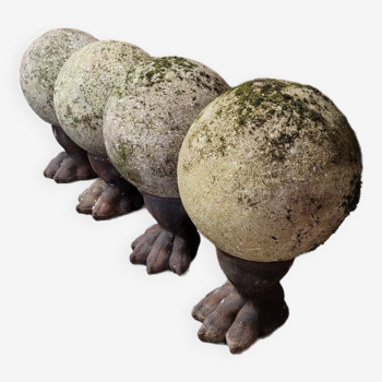 Cast iron lion paw feet with concrete garden balls