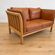 Vintage Danish 2 person sofa in cognac leather with oak frame