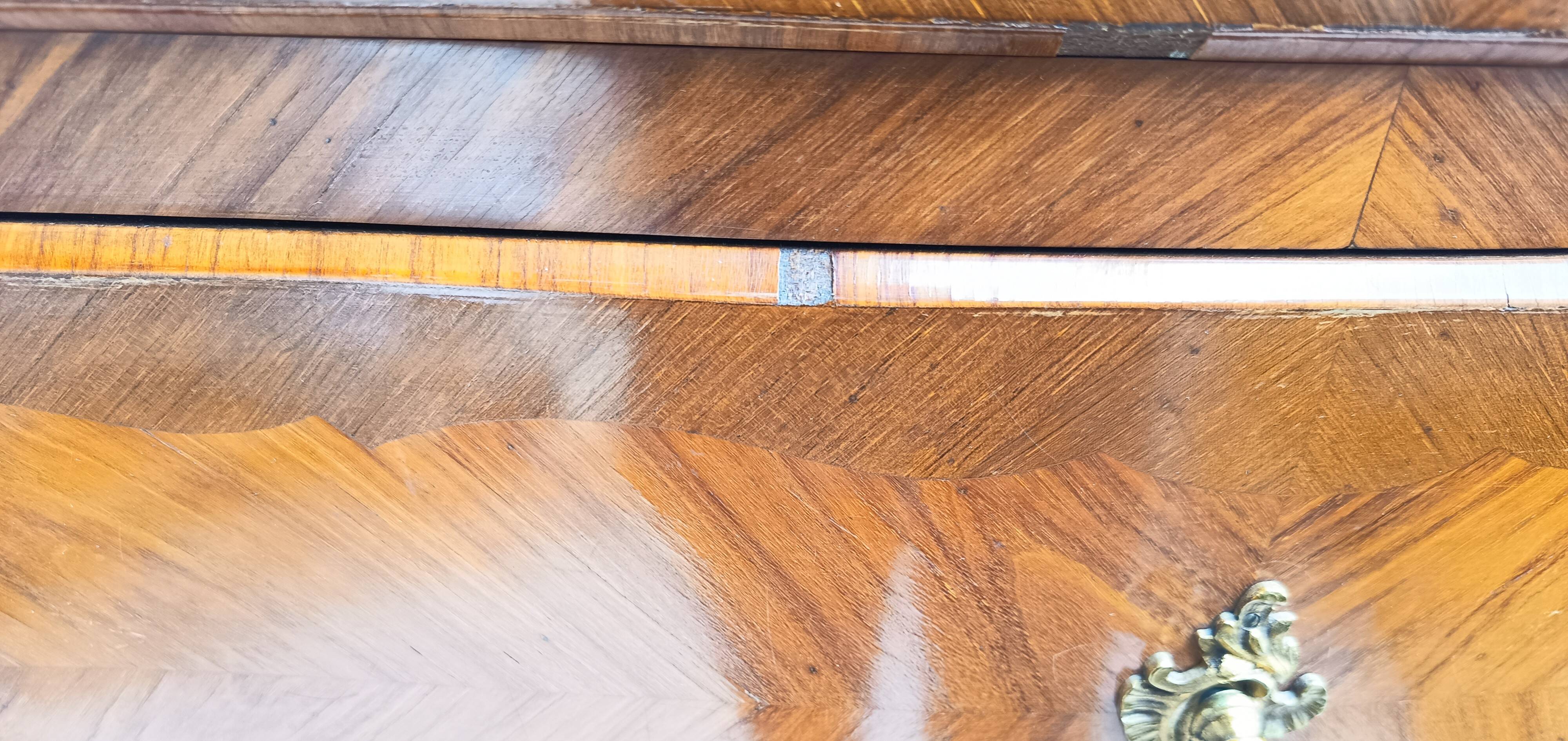 Louis XV style chest of drawers in precious wood veneer.