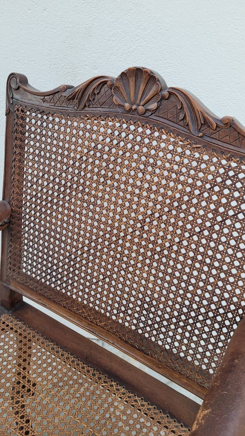 Louis XV Regency cane armchair leather armrests decorated with shell