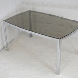 Living table. chrome metal, curved smoked glass slab, france, circa 1970.
