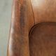 Vintage sheepskin club armchair finished with decorative nails