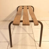 Old bench wooden slats and tubular metal base