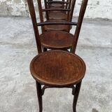 Série de 7 anciennes chaises bistrot Baumann bois courbé assise ronde