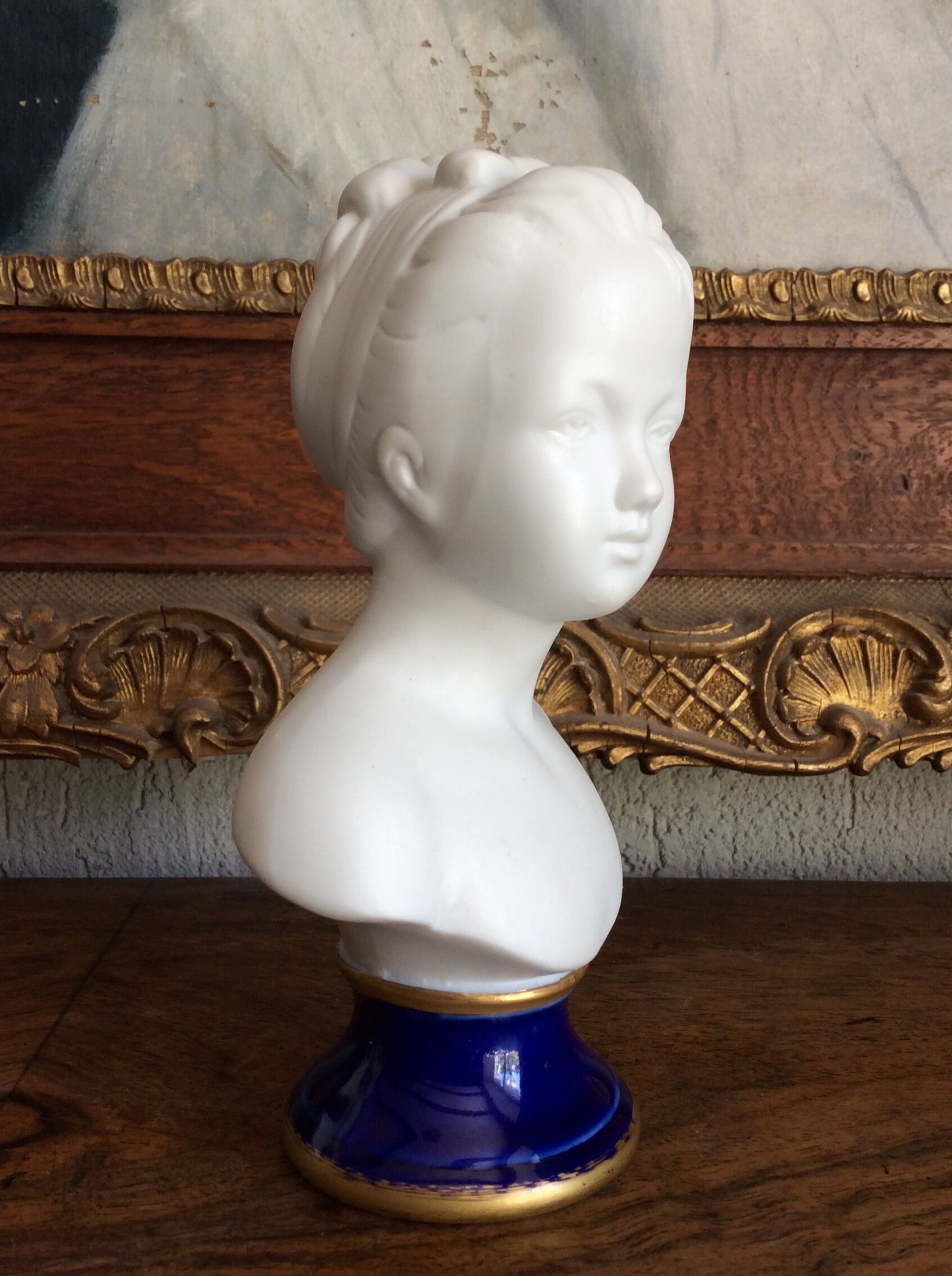 Small biscuit bust with blue base