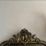 Napoleon III mirror with a pediment featuring black and gold dragons and birds.