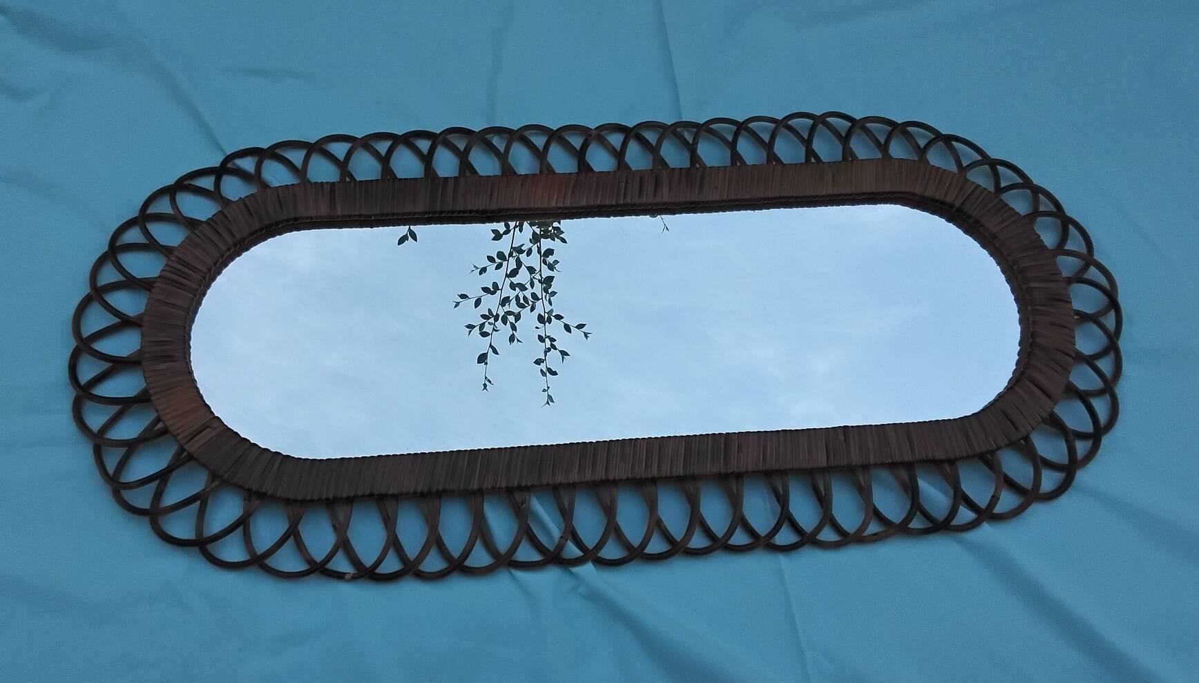 Oval mirror in rattan