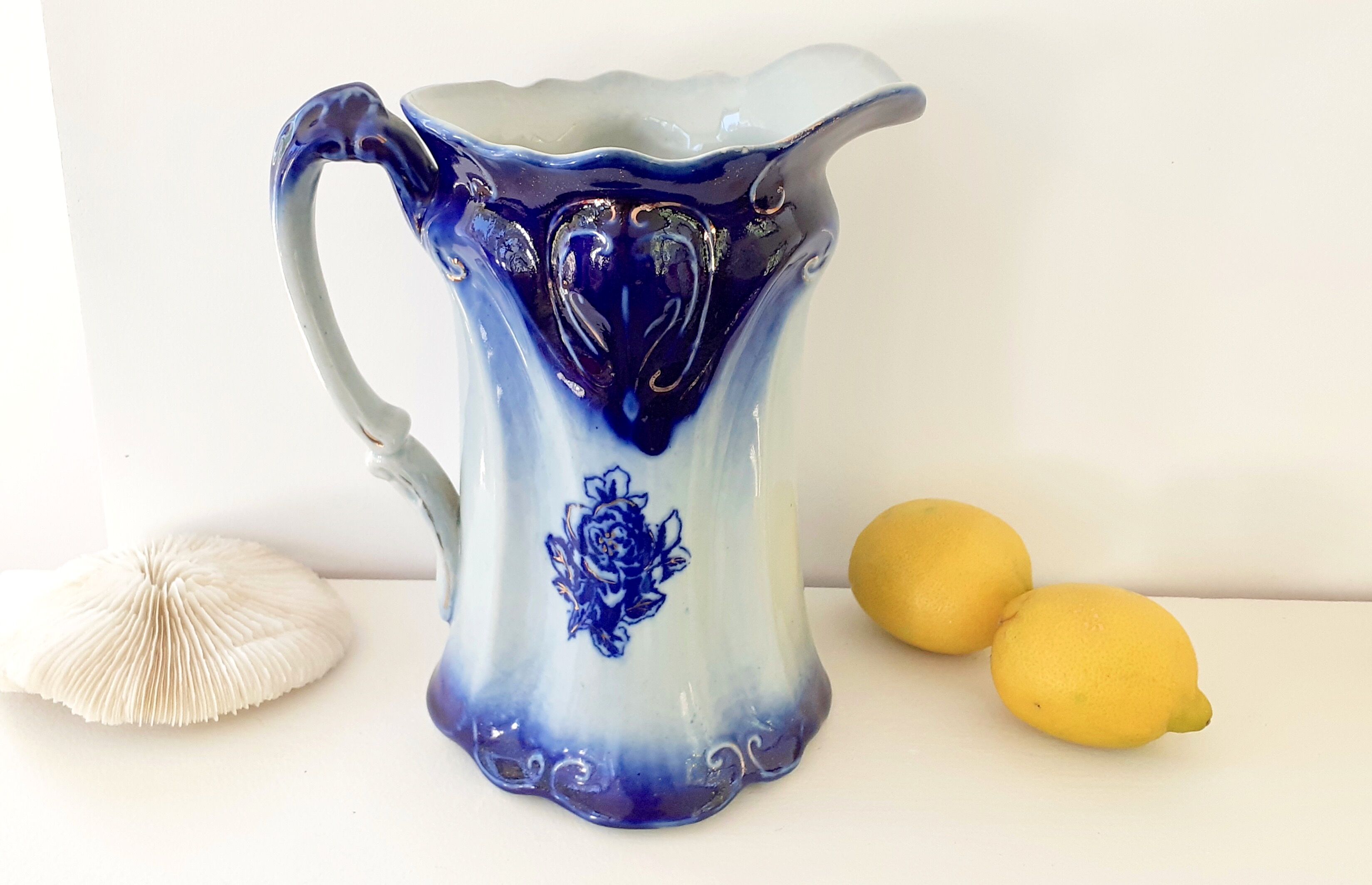 Old pitcher in blue flow, T.Rathbone, England circa 1910