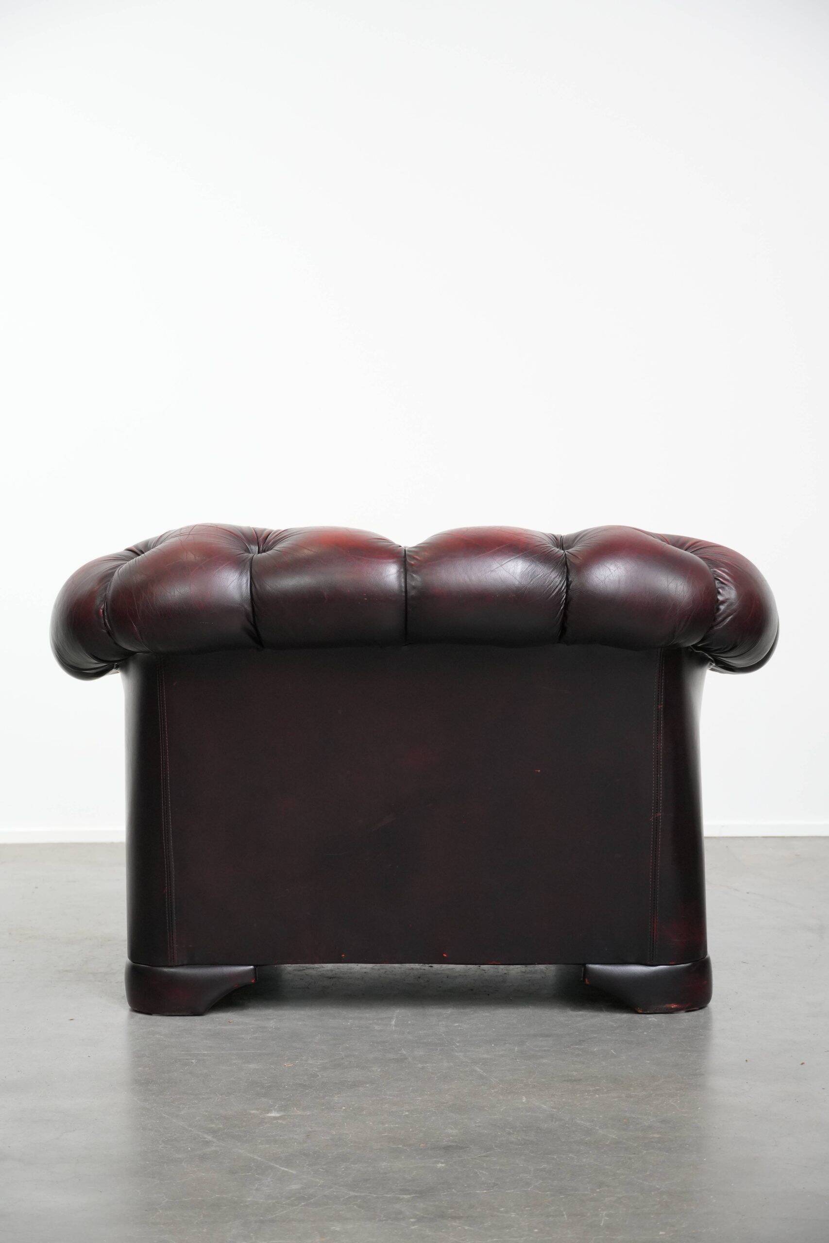 Classic cowhide Chesterfield button seat armchair in a beautiful red colour