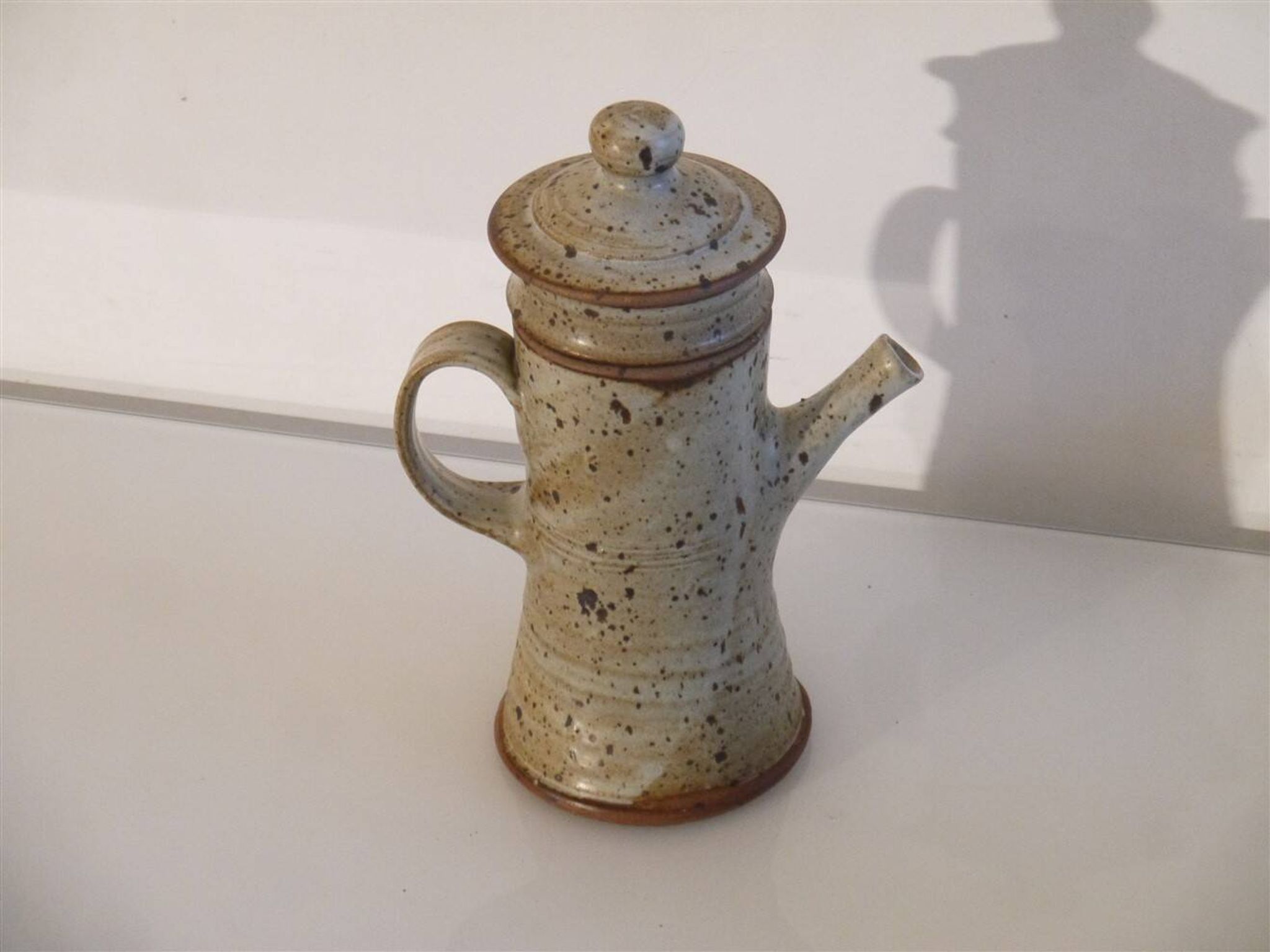 Teapot or stoneware coffee pot by Gustave Tiffoche.