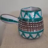 Coffee cup and small milk jug