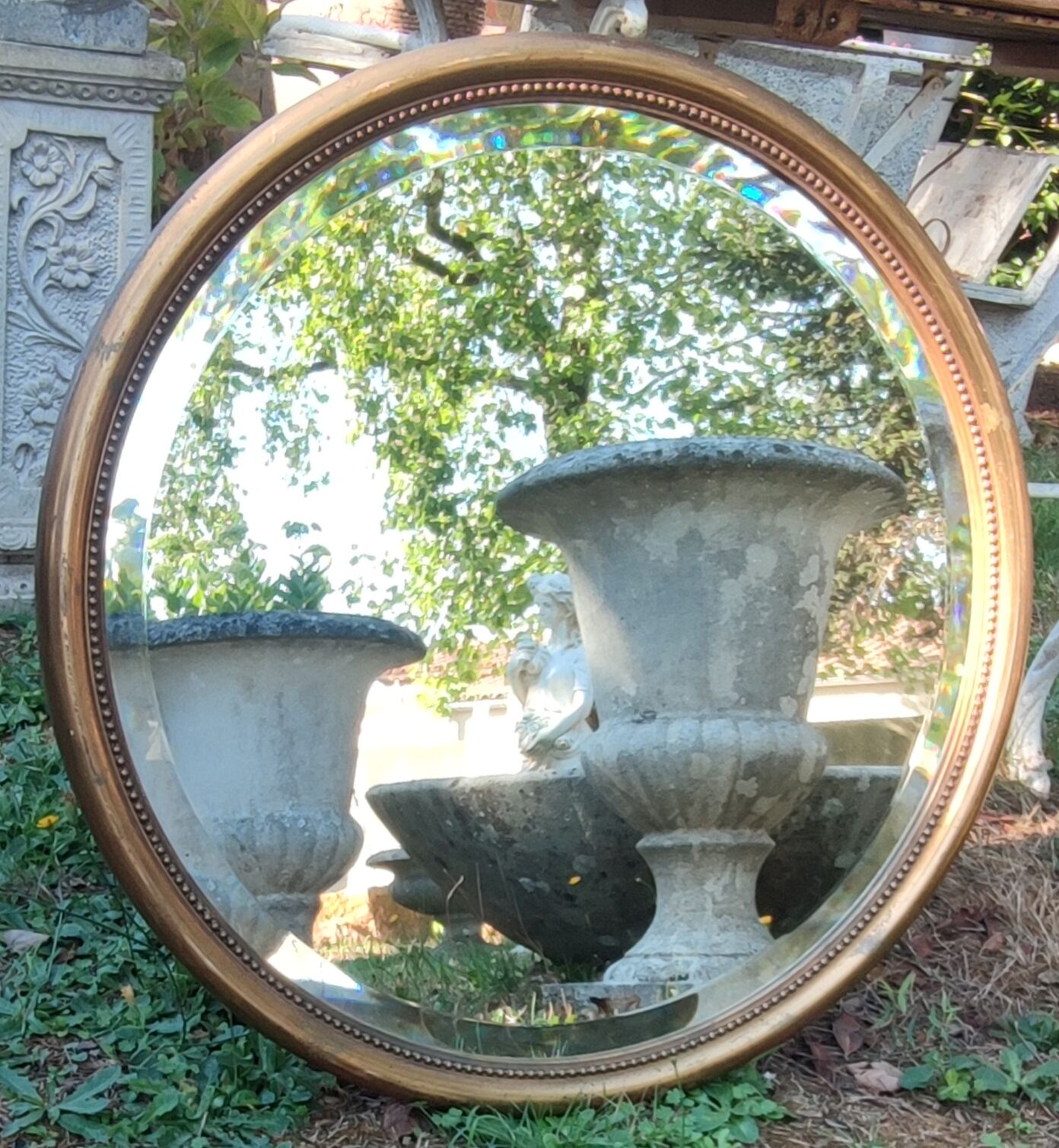 Old beveled round mirror