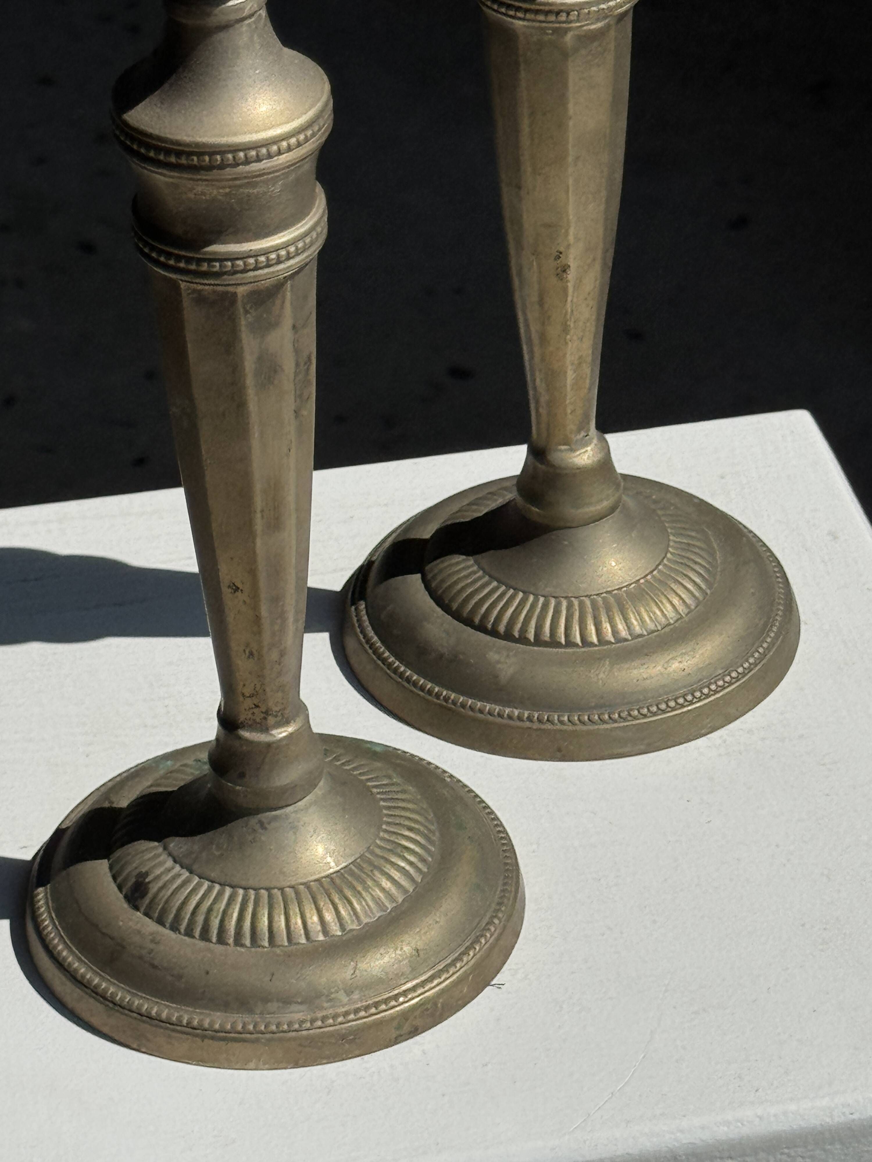 Pair of classic candlesticks in patinated gold metal H25