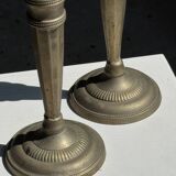 Pair of classic candlesticks in patinated gold metal H25