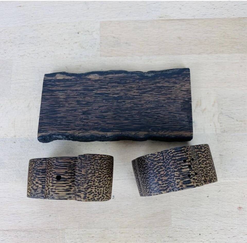 Vintage palm wood elephant salt and pepper shakers.