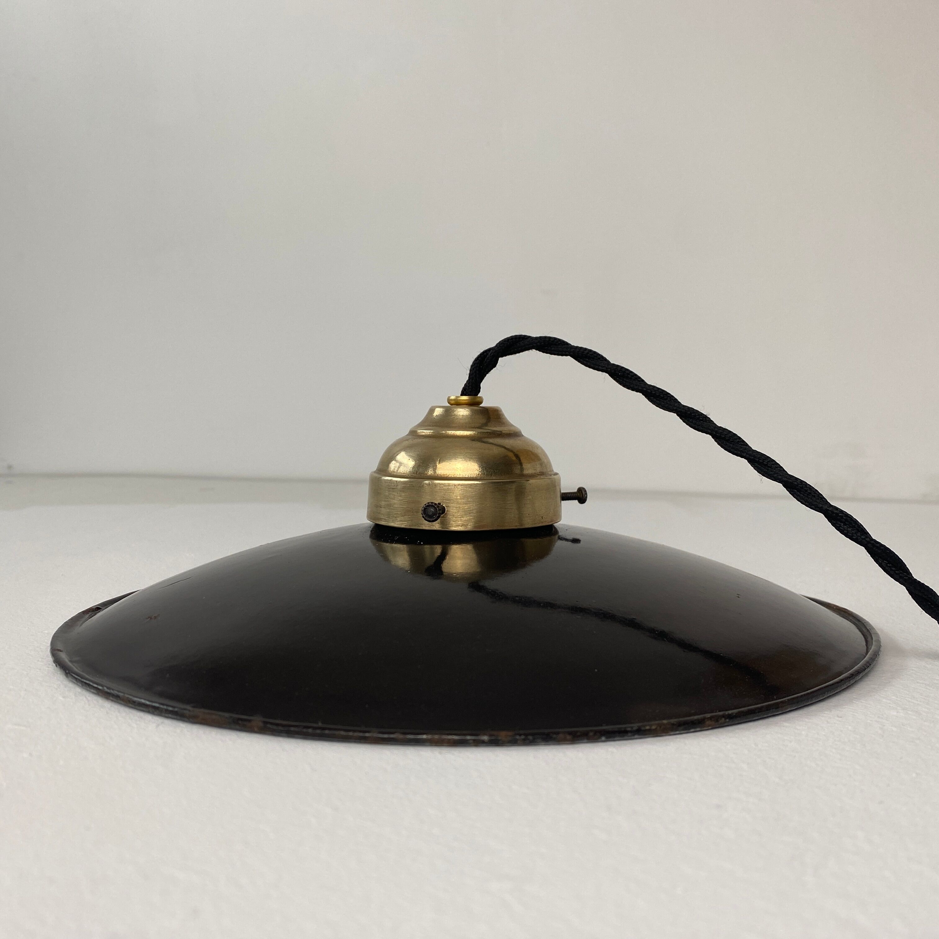 Old black enamelled industrial suspension