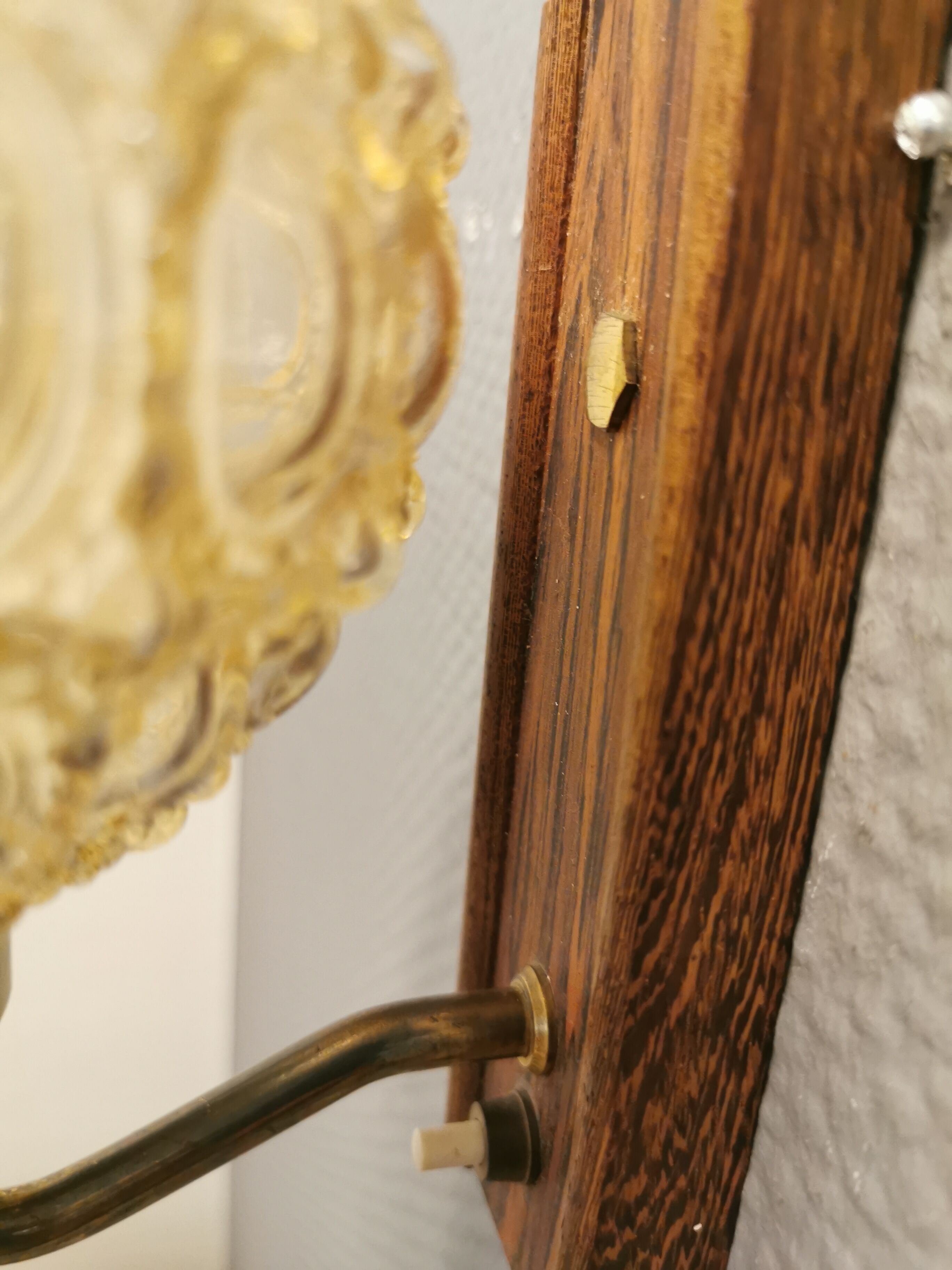 Wall light in rosewood with bobble glass ball shade.
