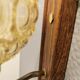 Wall light in rosewood with bobble glass ball shade.