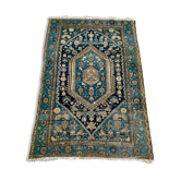 Persian carpet old green background, hand knotted, certified