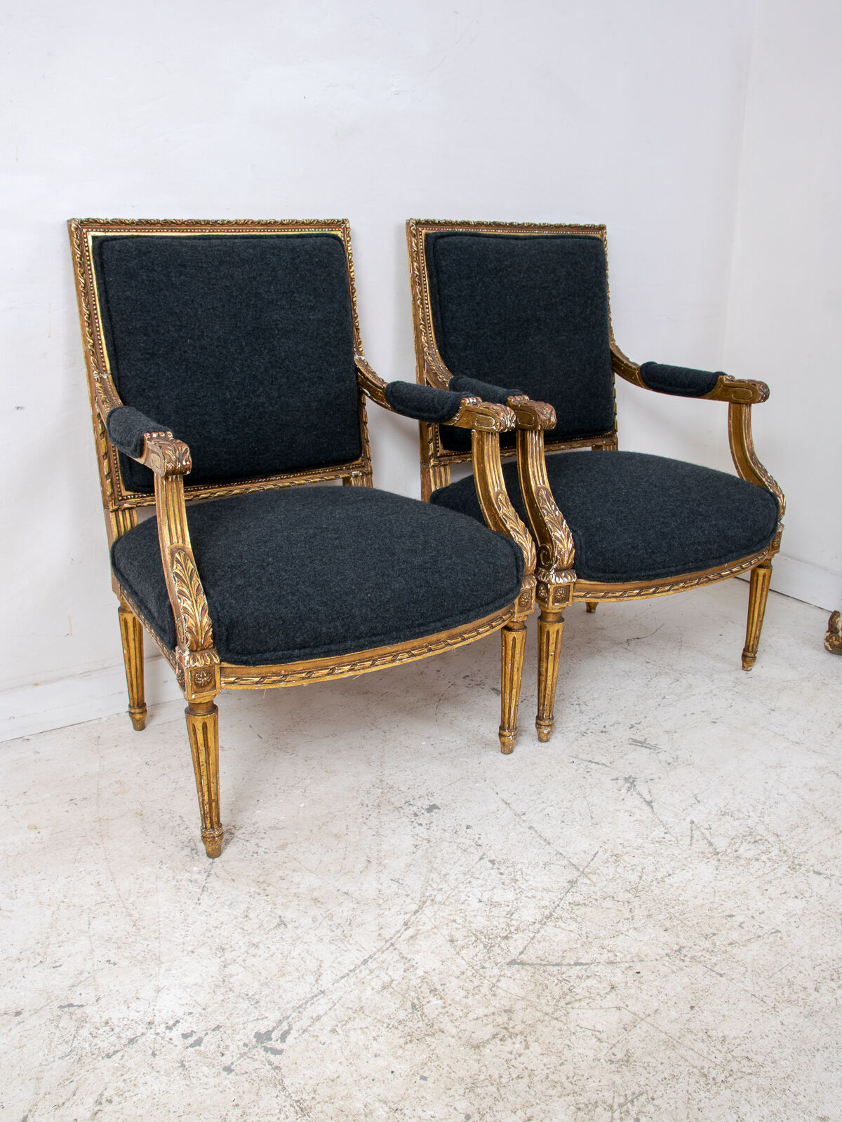 Pair of 19th century Louis XVI gilt armchairs newly re upholstered in holland and sherry fabric