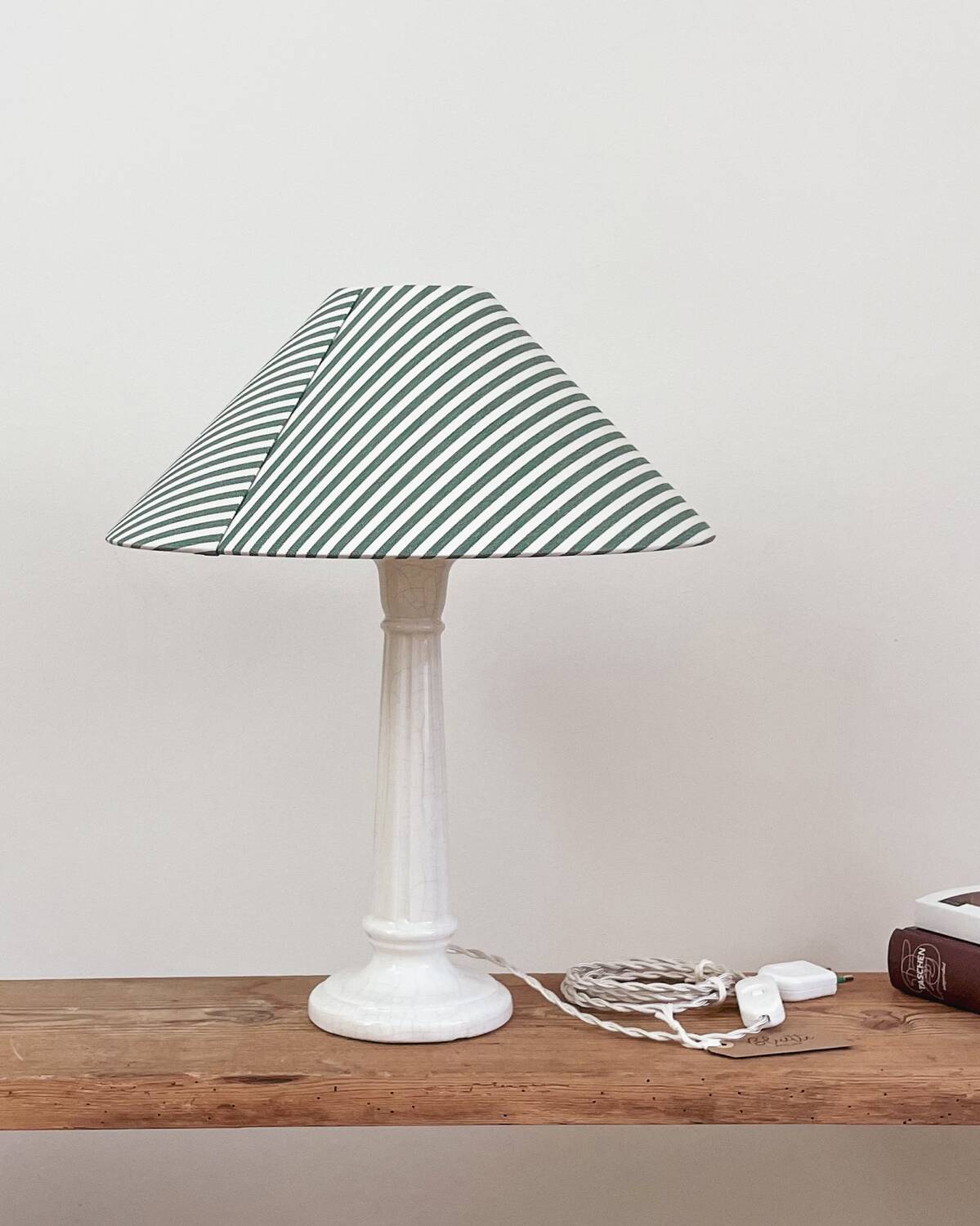 Earthenware lamp and striped lampshade
