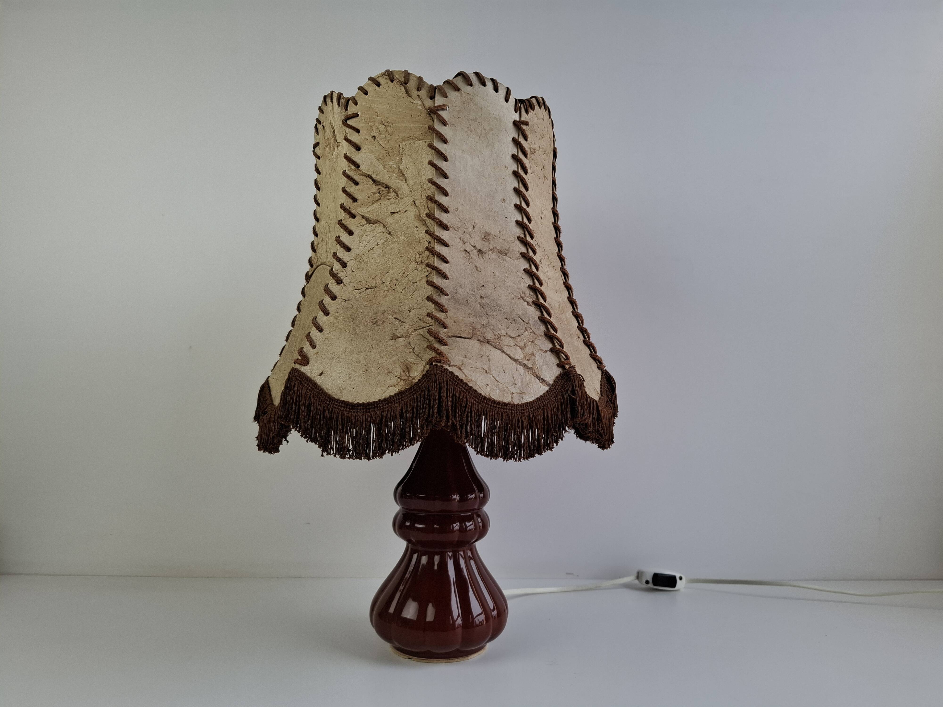 Vintage ceramic table lamp with hand-stitched leather shade, 1980s.