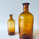 Duo of ancient apothecary flakes in amber glass