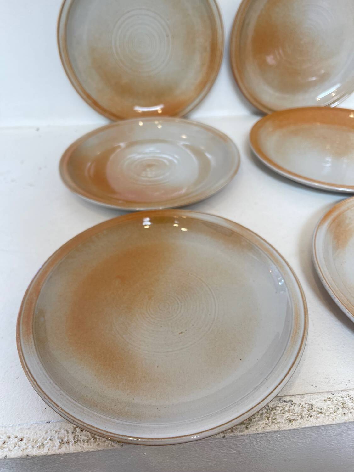 12 stoneware dessert plates, 1970