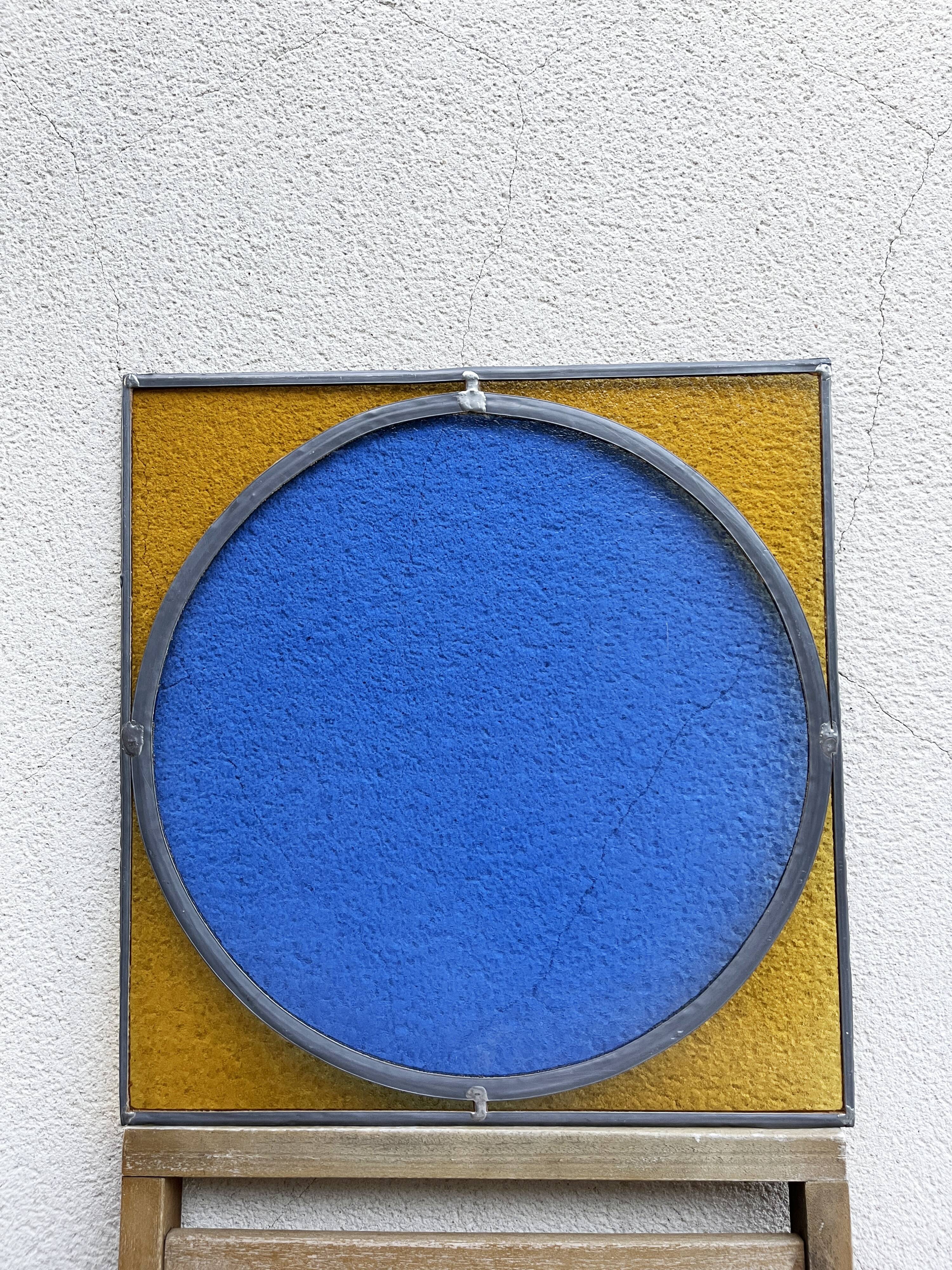 Pair of antique blue and yellow stained glass windows