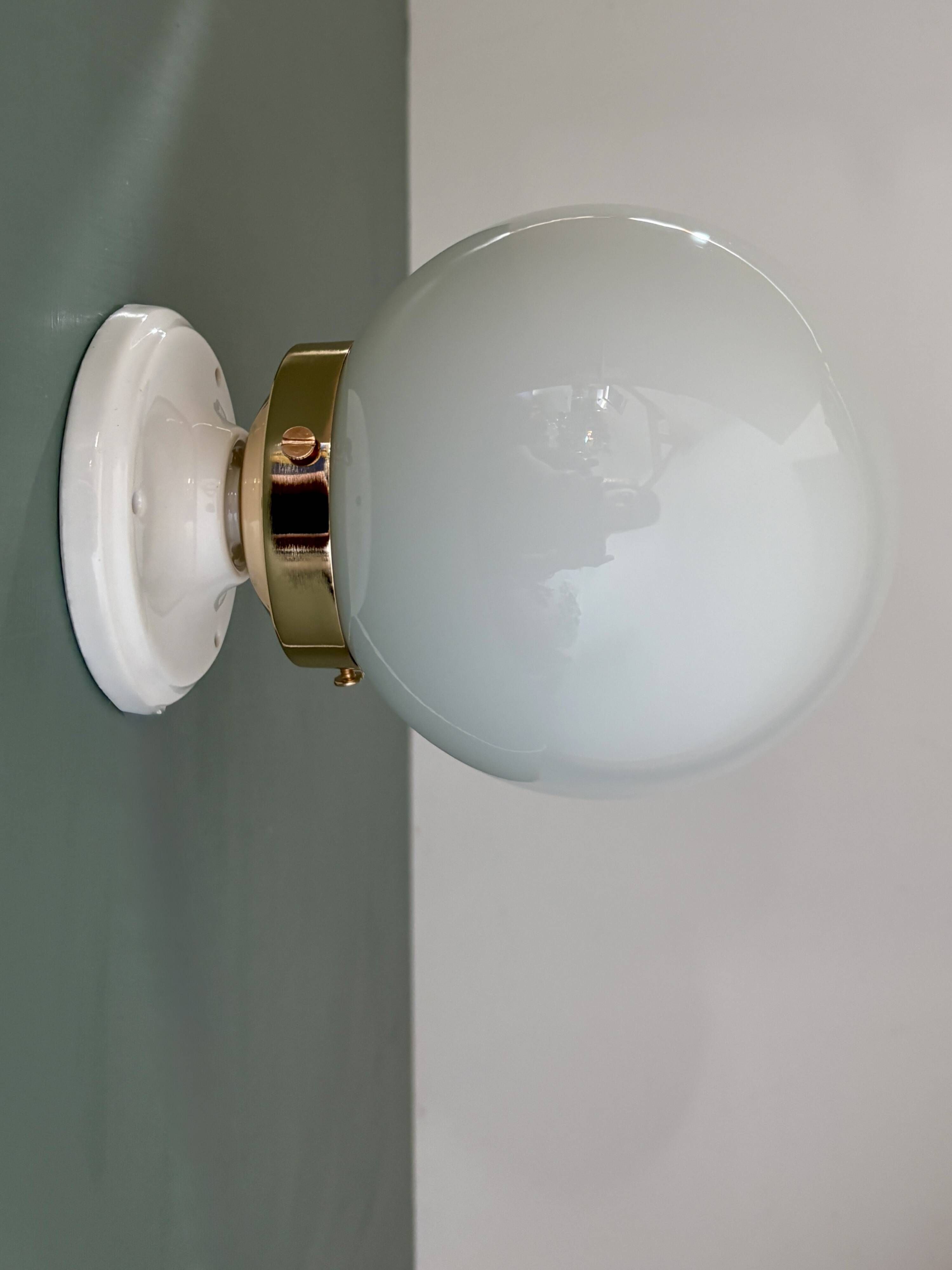 Vintage globe wall or ceiling light in white opaline.