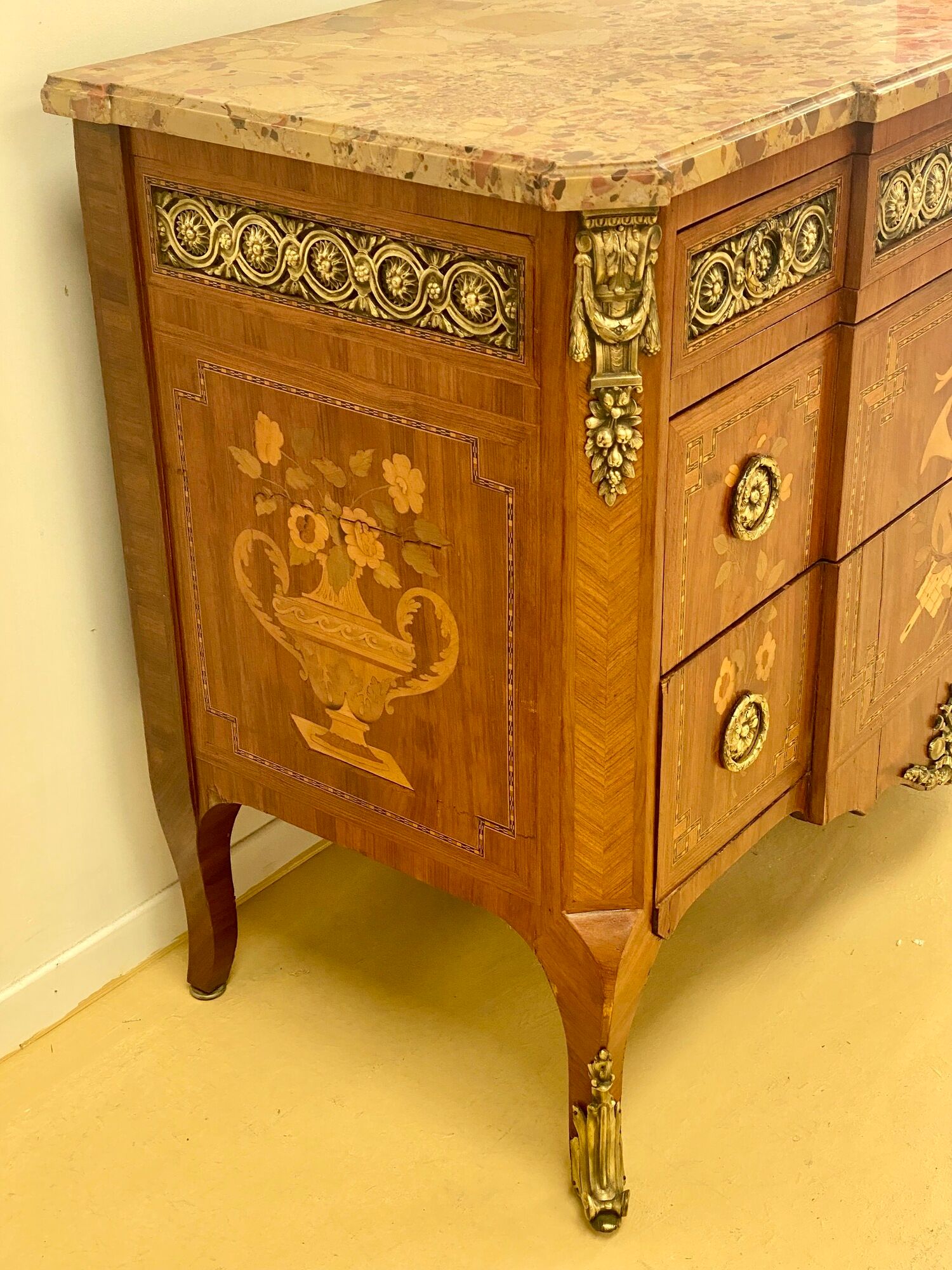 Transition chest of drawers with floral marquetry and music trophy