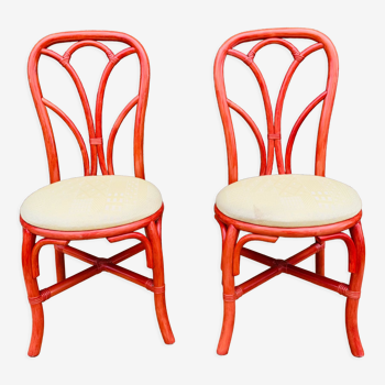 Pair of red rattan chairs and fabric