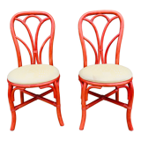 Pair of red rattan chairs and fabric