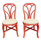 Pair of red rattan chairs and fabric
