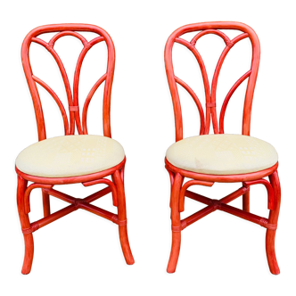 Pair of red rattan chairs and fabric