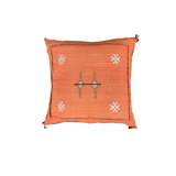 Coussin berbère Sabra orange à pompons